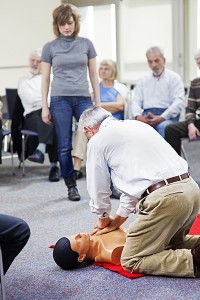 students practicing CPR on a typical dummy